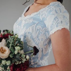 Lace wedding dress with blue lining and corset back
